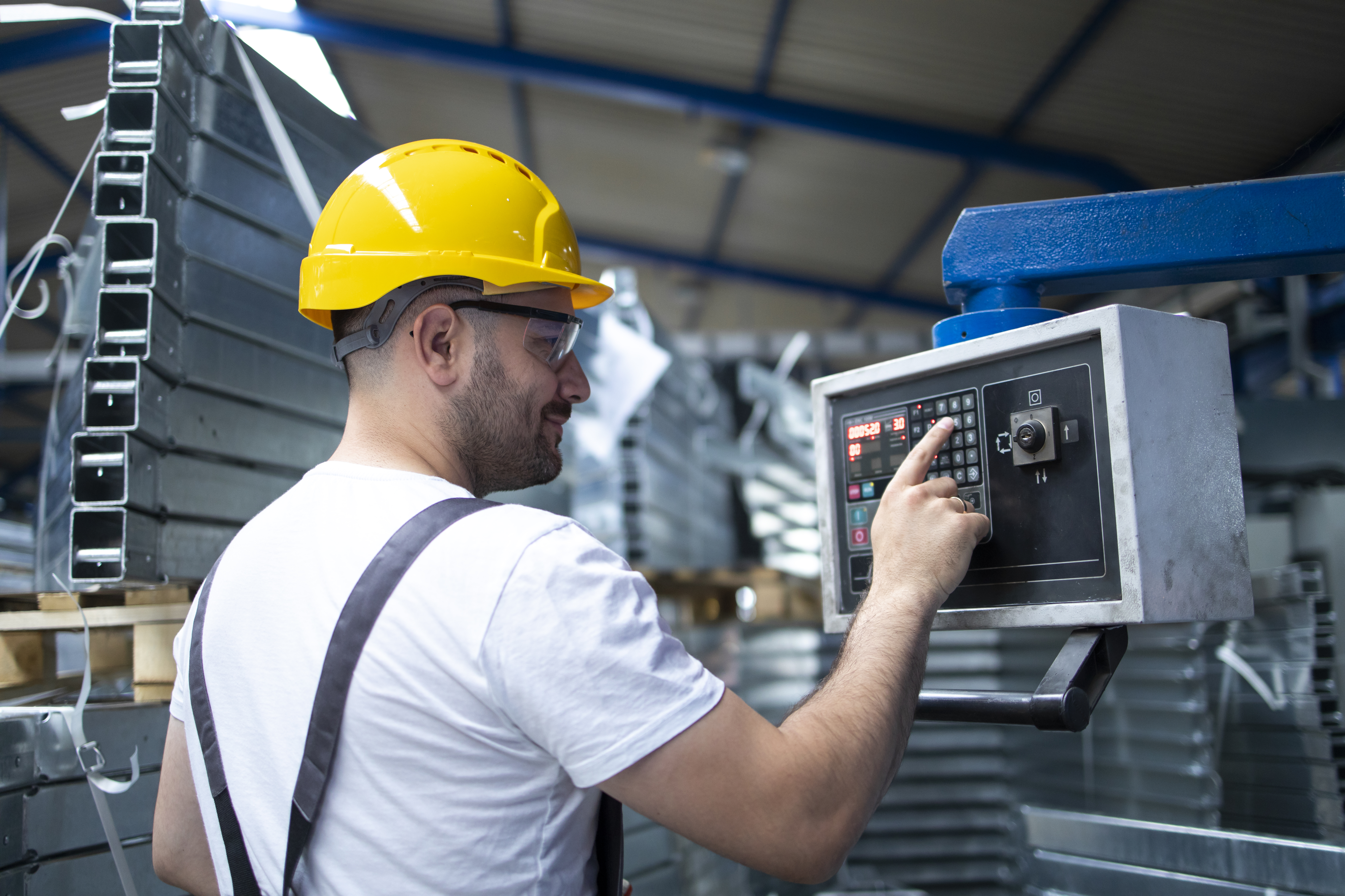 Worker operating industrial machine